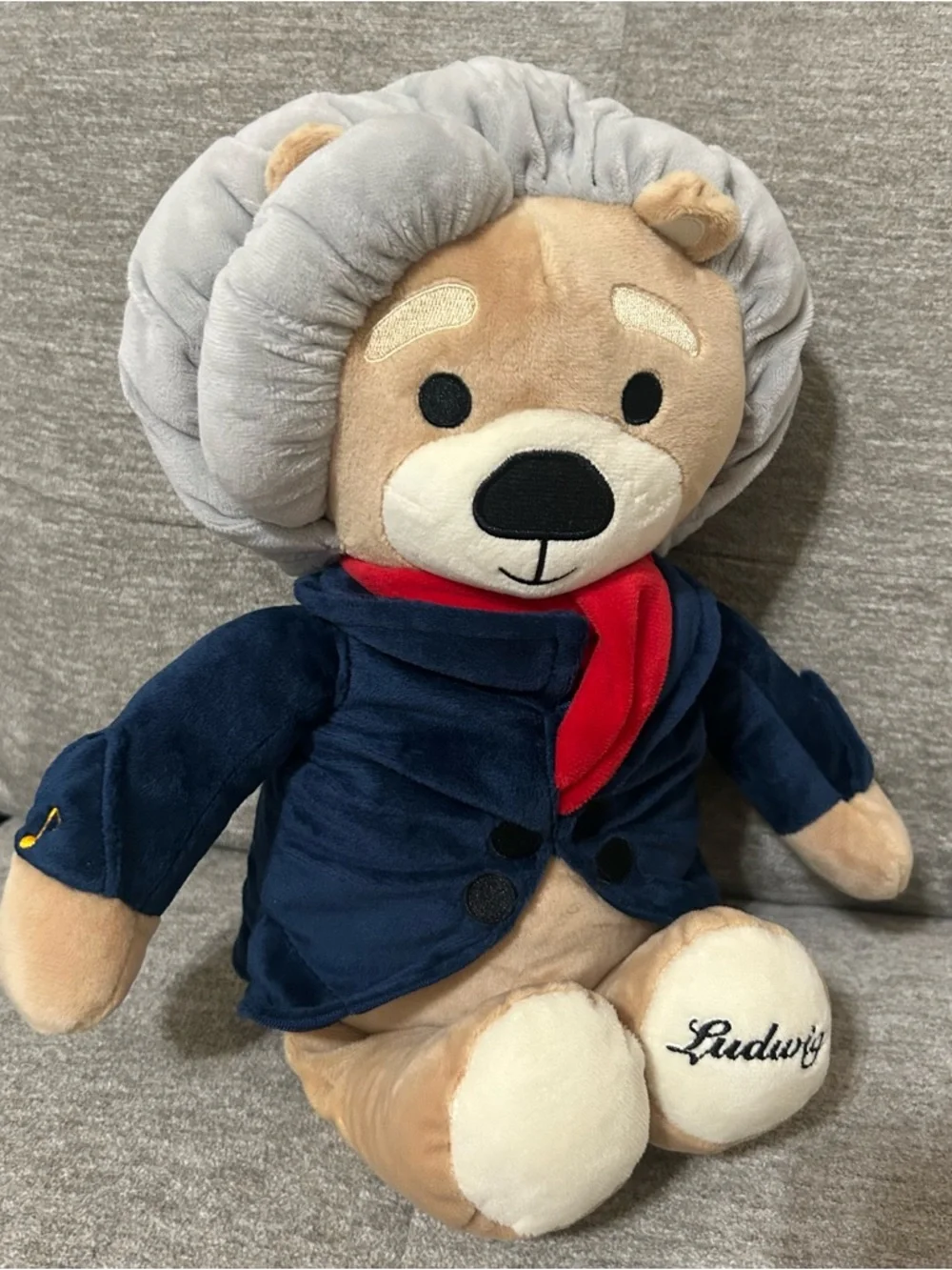 Plush Lion in Navy Jacket with Red Scarf